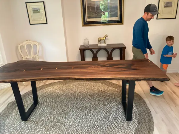 Live edge table with blackened steel legs