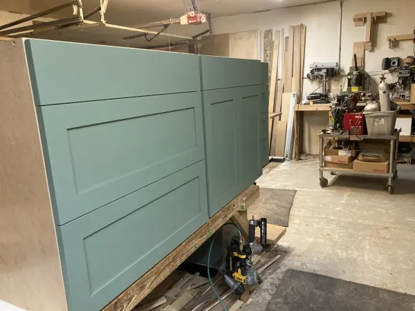 Shaker style painted kitchen cabinets, staged in the shop before install