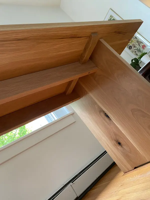 White oak dining table base view